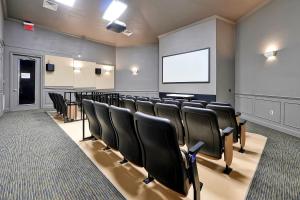 a conference room with chairs and a projection screen at Windsor Hills Resort - Water Park - Private Heated Plunge Pool - Near Disney in Orlando +61 photos