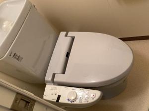 a close up of a toilet with a remote control at MONJUNO FUKUCHI - Vacation STAY 26041v in Kamikishida +1 photo