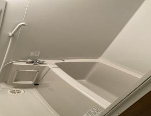 a bathroom with a sink and a toilet at MONJUNO FUKUCHI - Vacation STAY 26041v in Kamikishida