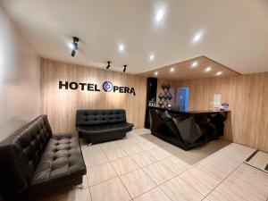 a hotel pera lobby with a couch and a desk at Hotel,Medellin,Opera,Entertaiment,Only adults,Turismocolombia-fit in Medellín