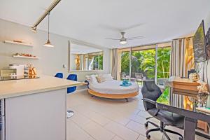 a kitchen and living room with a bed and a table at Napili Ridge - Vacation West Maui in Lahaina