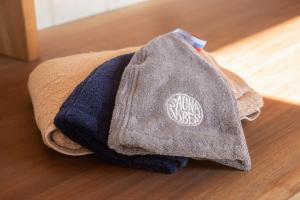 a pile of towels sitting on top of a wooden floor at THE W Relax Garden Resort - Vacation STAY 09071v in Yoshioka +34 photos