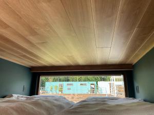 a bed in a room with a large window at THE W Relax Garden Resort - Vacation STAY 09071v in Yoshioka