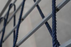 a close up of a rope hanging from a ceiling at Appartamento in centro - Blu Mare in Gaeta