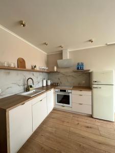 Η κουζίνα ή μικρή κουζίνα στο Apartament KAJA