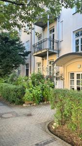 a building with a walkway in front of it at Exklusive 60qm Designerwohnung im Herzen von München - 1 min zur Maximilianstraße in Munich