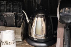 a black and silver tea kettle on a table at Disney Style Hotel "J Hotel" - Vacation STAY 17216v in Chiba