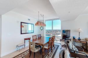 a dining room with a table and chairs at Palazzo 1401 in Panama City Beach