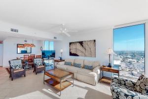 a living room with a couch and a table at Palazzo 1401 in Panama City Beach