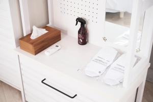 a white cabinet with a bottle of soap at EIGHT VILLAGE - Vacation STAY 40437v in Katakai