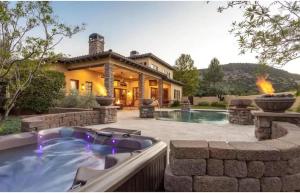 a house with a hot tub in a yard at Enchanting Sedona Villa with Views Spa and Pool in Sedona