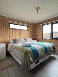 Postel nebo postele na pokoji v ubytování Cabaña Casa Calbuco + 7 fotografií