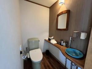 a bathroom with a toilet and a sink at Peace Inn Hagi - Vacation STAY 92117v in Hagi +11 photos