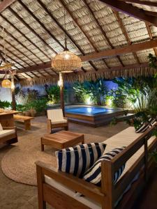 a patio with a swimming pool in the background at Casa Taquirí in Santo Amaro