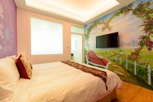 TV in/ali zabaviščno središče v nastanitvi Love in Hengchun B&B