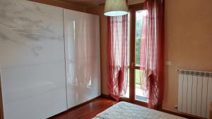 Postel nebo postele na pokoji v ubytování Appartamento Primavera