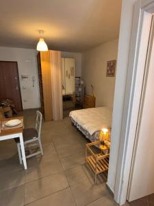 a bedroom with a bed and a table and a table and chair at Galatea in Santo Stefano di Magra +2 photos