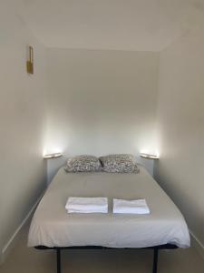 Ένα ή περισσότερα κρεβάτια σε δωμάτιο στο Appartement les Remylis