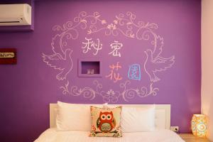 Postelja oz. postelje v sobi nastanitve Love in Hengchun B&B