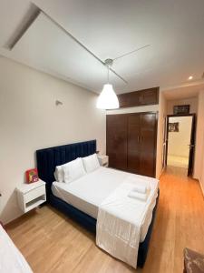 a bedroom with a large bed in a room at Diamond Residence Fes in Fez