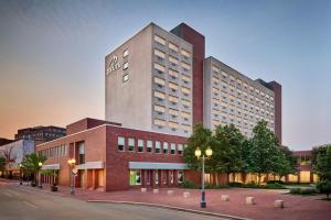 a rendering of a hotel building on a street at Delta Hotels by Marriott Beausejour in Moncton