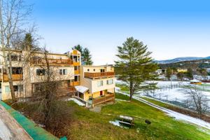 an aerial view of a building on a hill at Mountainside Resort F303 in Stowe