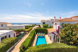 an aerial view of a villa with a swimming pool at Villa Sunflower by Villa Plus in Cala Blanca