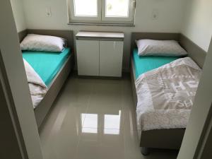Postel nebo postele na pokoji v ubytování Apartmani Zaton
