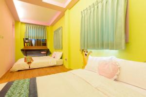 Postelja oz. postelje v sobi nastanitve Love in Hengchun B&B