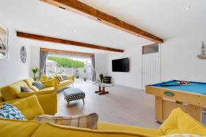 a living room with a pool table at Neptune in Saundersfoot