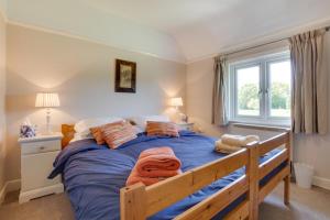 Ένα ή περισσότερα κρεβάτια σε δωμάτιο στο Penhill Cottage