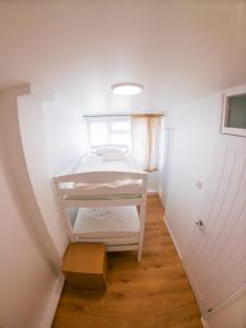 Ένα ή περισσότερα κρεβάτια σε δωμάτιο στο fabulous apartment near wembley