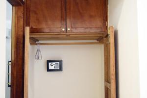 a cabinet above a wall with a picture on it at Casa Macuil in Brisas de Zicatela