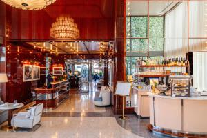 a lobby of a restaurant with a bar at Mr C Miami Coconut Grove in Miami