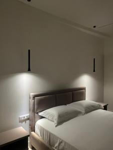 Ένα ή περισσότερα κρεβάτια σε δωμάτιο στο Hotel Gramozi
