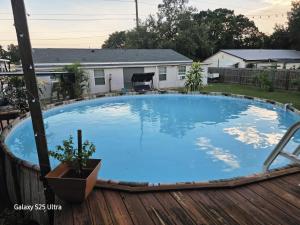 a large blue swimming pool on a deck at Rv Getaway in Lakeland