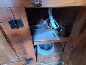 a view from the inside of a cabin with a bucket at Lindo flat Caxambu Vila Rica Pampulha in Venda Nova +3 photos