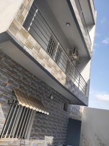 an external view of a building with a balcony at casa mara dakar in Bargny