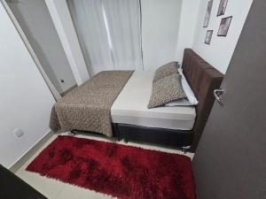 Una cama o camas en una habitación de Aconchego