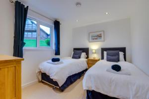 En eller flere senge i et værelse på Calypso