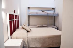 Posteľ alebo postele v izbe v ubytovaní B&B Ghalà