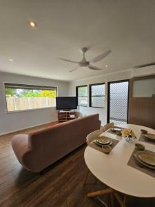a living room with a couch and a table at Self-Contained 2BR Guest Suite with On-site Parking in Rochedale South