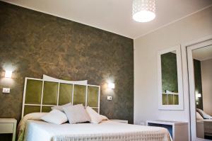 Posteľ alebo postele v izbe v ubytovaní B&B Ghalà
