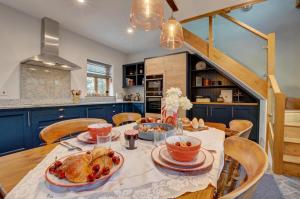 a kitchen with a table with food on it at Hillside The Barn in Croyde