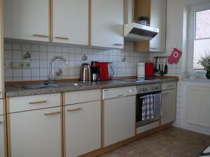 Η κουζίνα ή μικρή κουζίνα στο Osterdeich Apartment 5