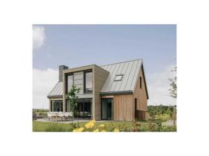 a house with a metal roof at Holiday home with 2 bedrooms in Veere