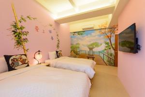 Postelja oz. postelje v sobi nastanitve Love in Hengchun B&B