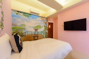 TV in/ali zabaviščno središče v nastanitvi Love in Hengchun B&B