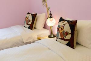 Postelja oz. postelje v sobi nastanitve Love in Hengchun B&B
