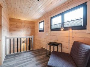 a living room with a couch and a window at Bergwaldchalet Wellness 7 in Schierke